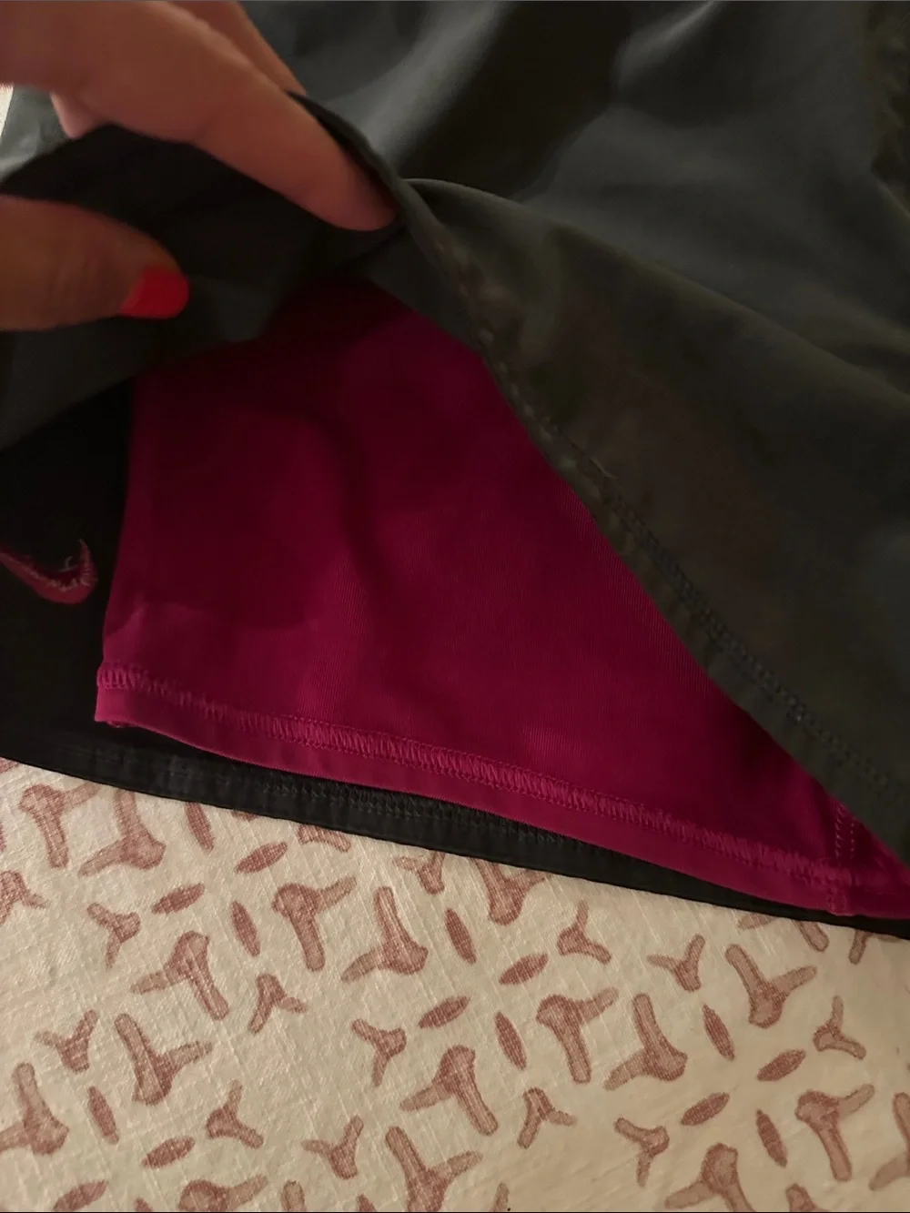Nike Women’s Black Athletic Shorts with built in pink under shorts.